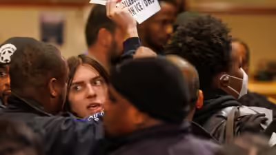 anti-ice-protesters-disrupted-the-city-council-meeting-ap.jpg