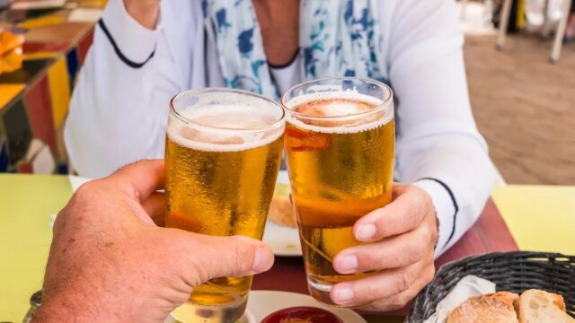 couple-toasting-with-beer.jpg