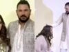 Hazel Keech conserta docemente a roupa de Yuvraj Singh